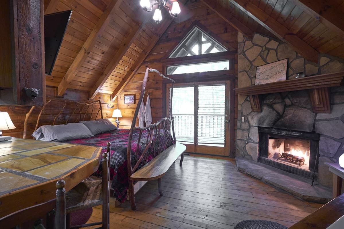 Wild Columbine interior with a stone wood-burning fireplace